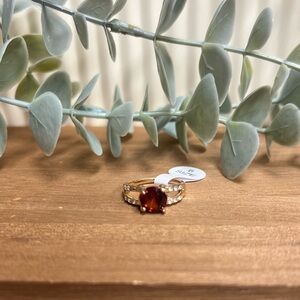 Gold CZ Ring with Deep Red Gemstone and Accent Stones